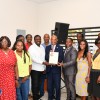 Minister for Health and Social Development Hands Over Memorial Plaque to the Family of George W. Christopher