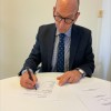 Governor signs vetting agreement