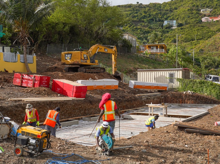Workers Laying Foundation at Long Look Social Home Complex