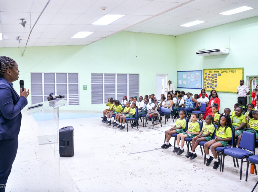 Hon de Castro Speaking to Students at Ivan Dawson Playground Dedication
